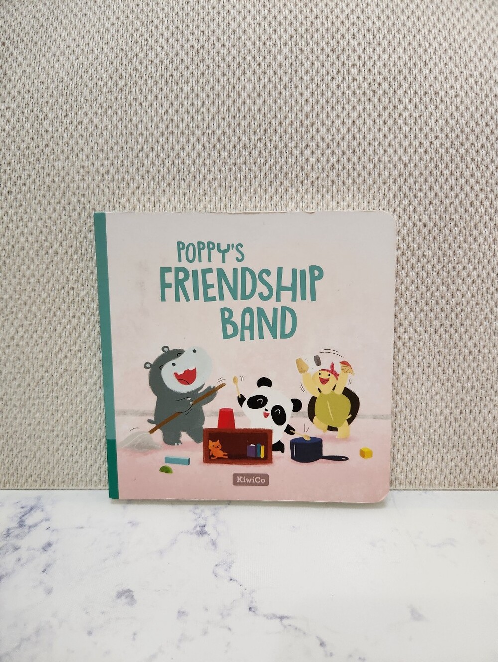 KiwiCo Poppy's Friendship Band Board Book